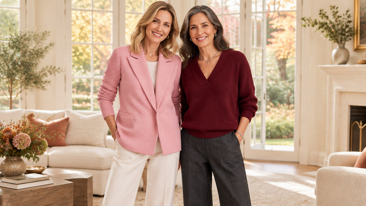 Two women wearing a pale pink knit-sleeve blazer and burgundy V-neck sweater in a bright autumn interior.